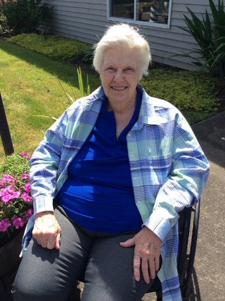 A CHCC resident named Joyce sitting outside.